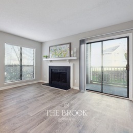 living with fireplace and large windows
