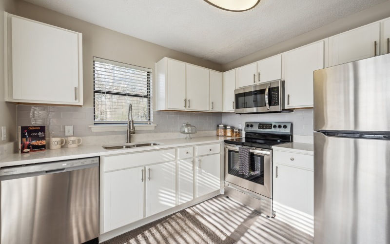 kitchen with white cabinets and stainless steel appliances