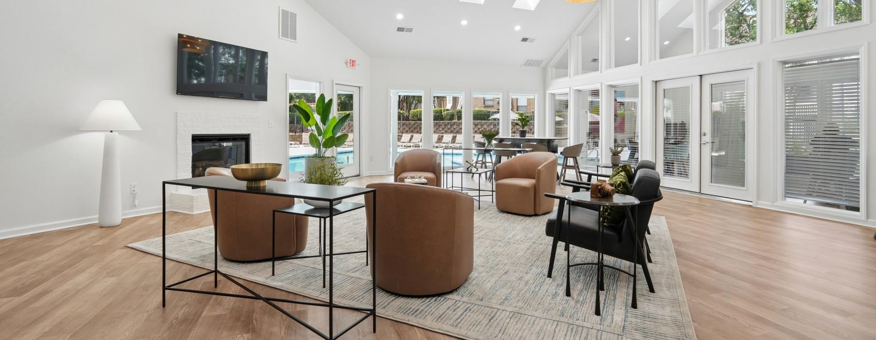 a room with a table chairs and a chandelier