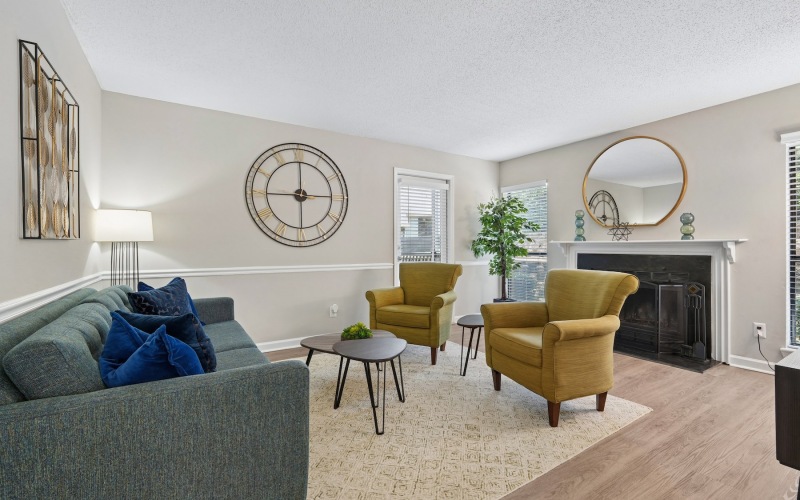 living room with furniture fireplace and large mirror