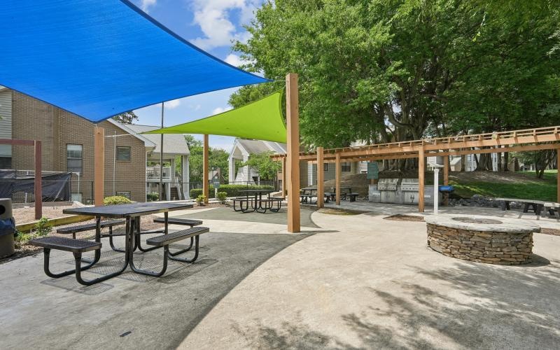 a picnic table and umbrellas