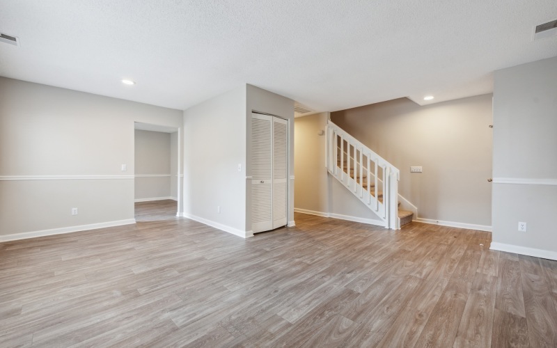 living room with wood floors and staircase