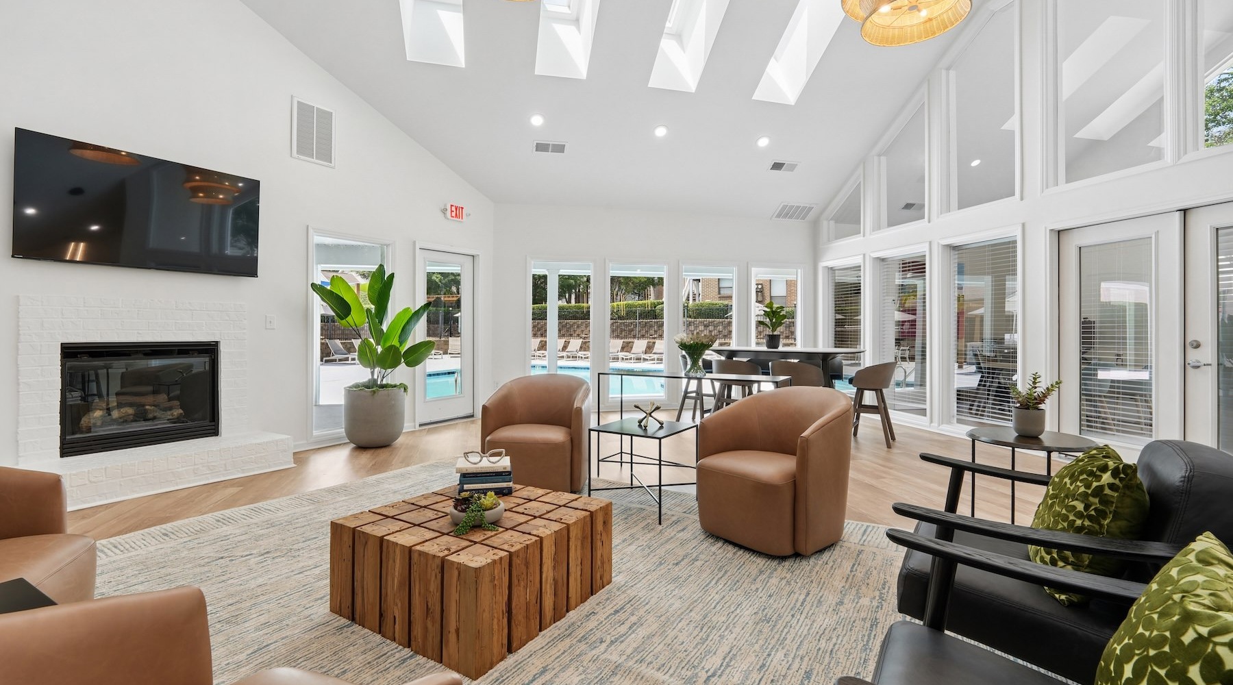 lounge with seating fire place and tv